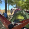 evento in Calabria dal nome emotional village a cura di Tspace: foto del camping sulla Sila allestito ex novo con amache tende e lucine